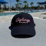 Giplings navy color hat with pink letters with pool