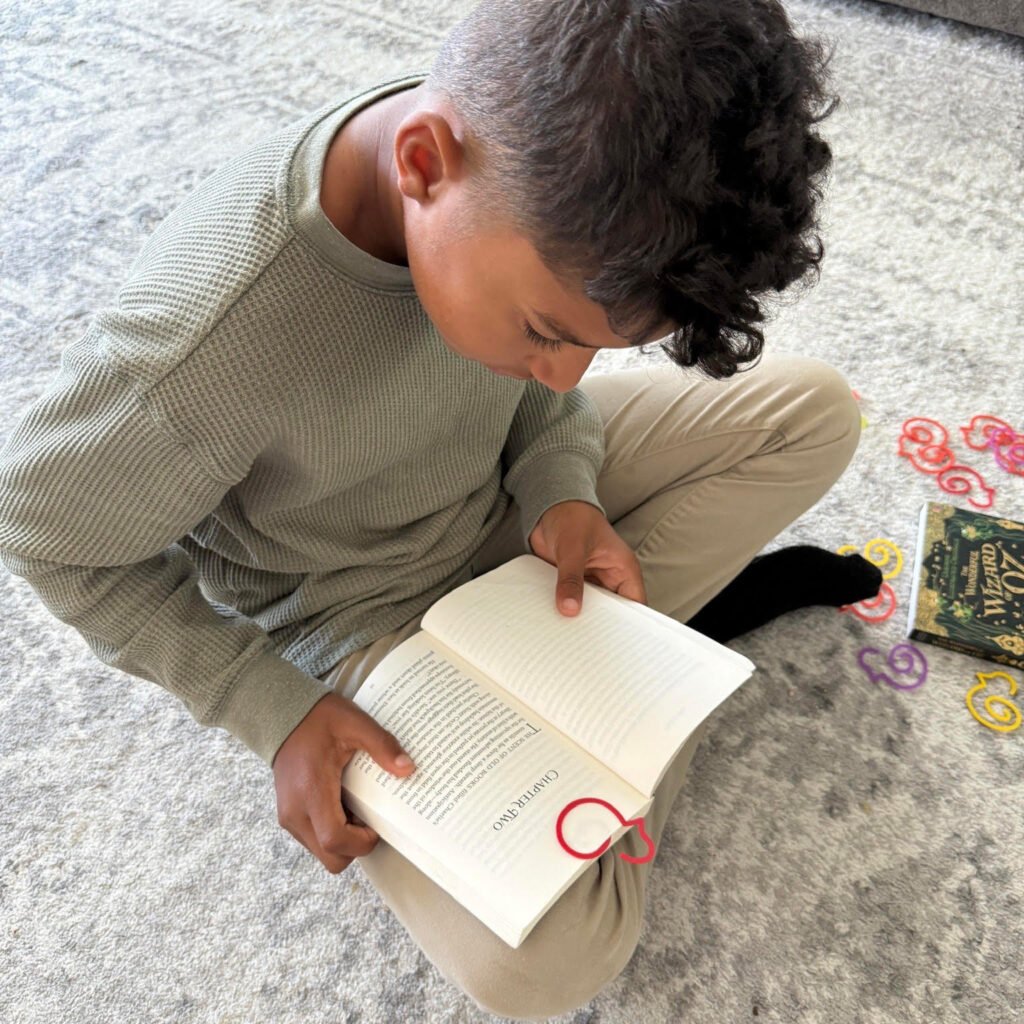 Duck-links bookmark inside a children’s book supporting early reading