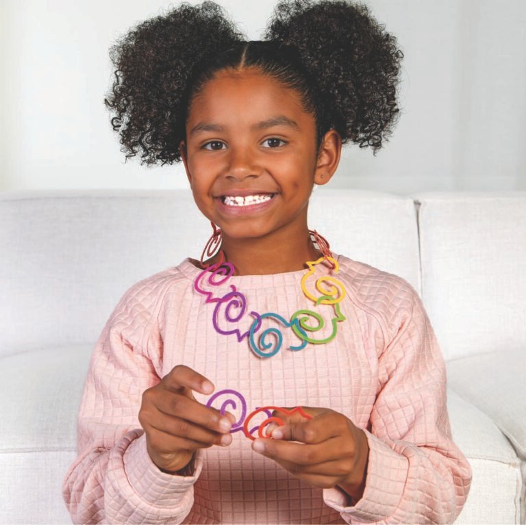 Duck-links are great for open-ended play displayed by this girl wearing a Duck-links necklace
